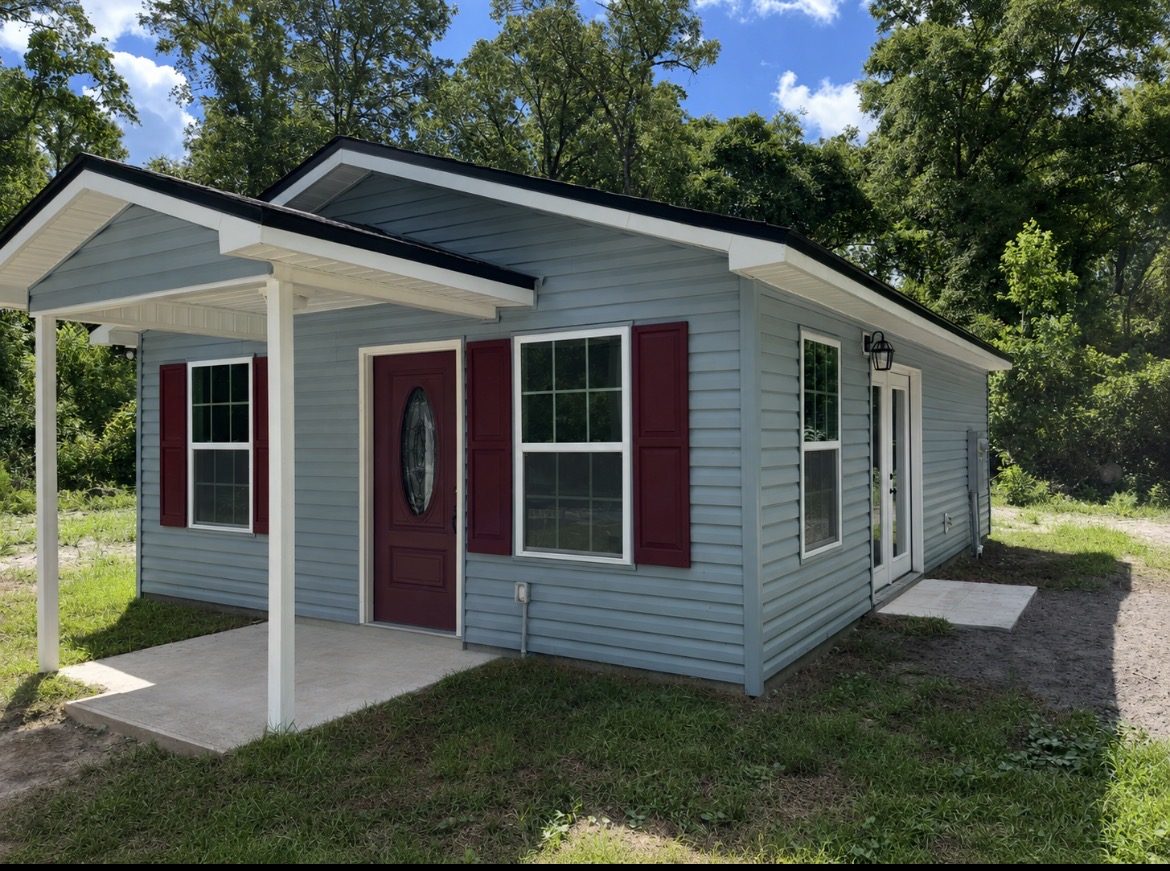 Completed tiny home exterior with covered porch